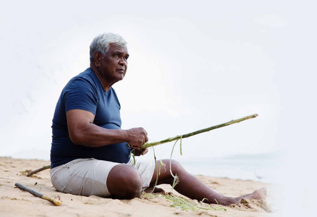 Russell Butler, a Bandjin traditional owner from Hinchinbrook Island, in a scene from the documentary TV series Life on the Reef. RIGHT: A turtle comes ashore to lay its eggs on Raine Island. Russell Butler, a Bandjin traditional owner from Hinchinbrook Island, in a scene from the documentary TV series Life on the Reef. RIGHT: A turtle comes ashore to lay its eggs on Raine Island.